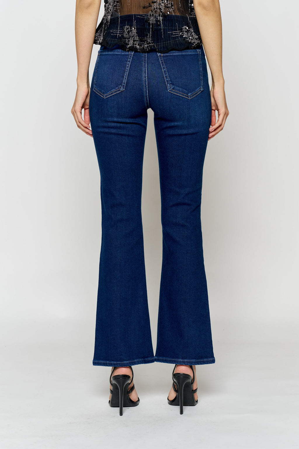 Women's bootcut jeans in dark blue, perfect for pairing with boots