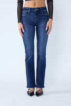 Women's bootcut jeans in dark blue denim, perfect for pairing with boots