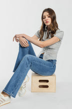 Women's bootcut jeans in blue, perfect for pairing with boots