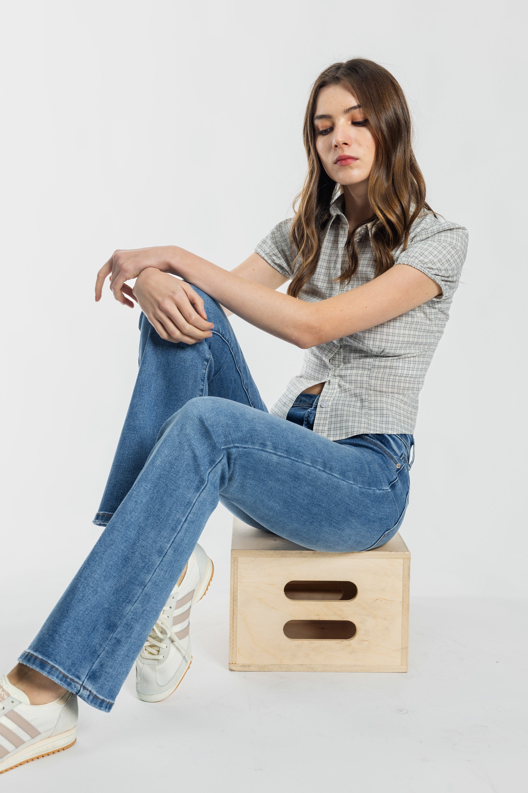 Women's bootcut jeans in blue, perfect for pairing with boots