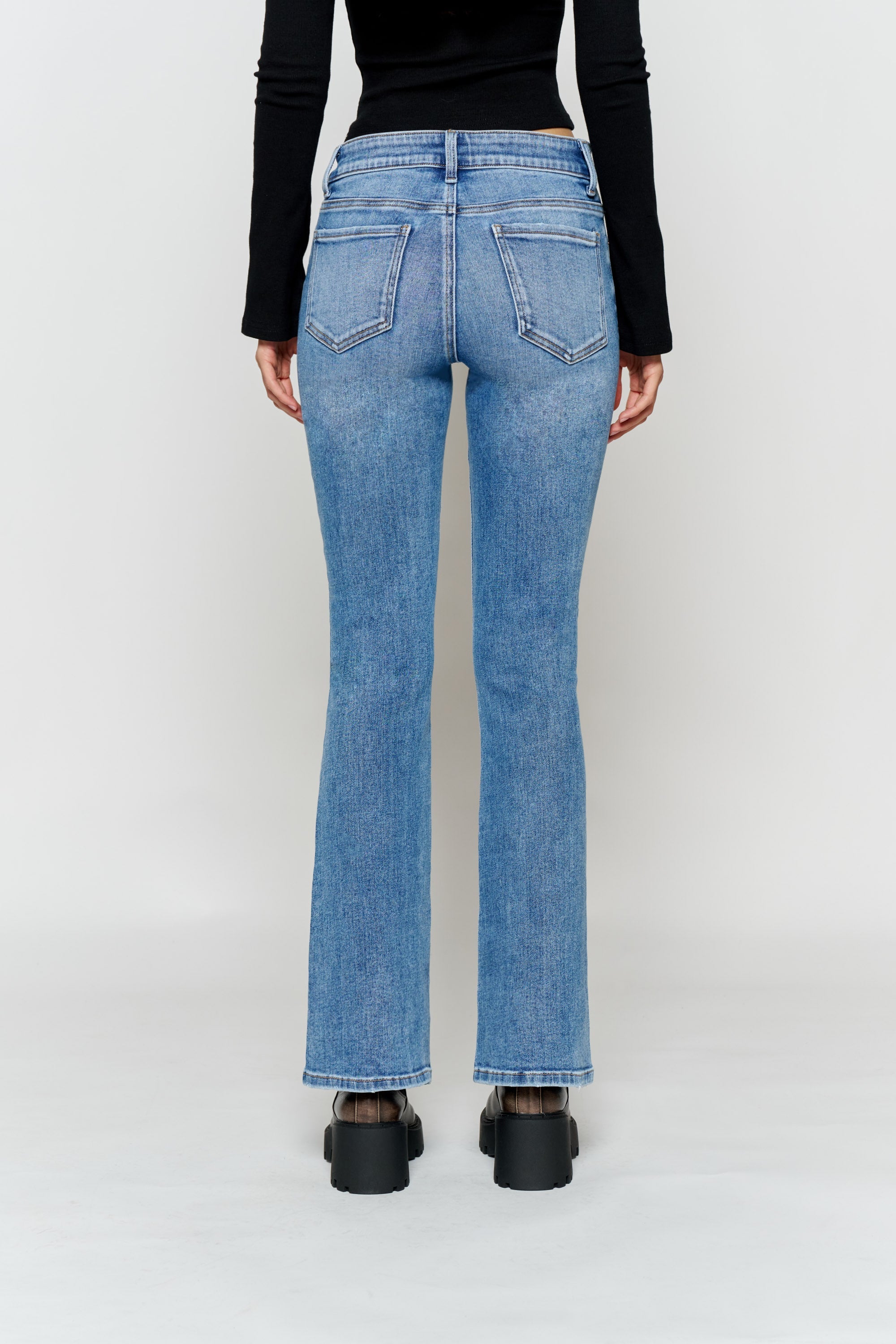 Women's bootcut jeans in light blue denim, perfect with boots