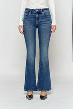 Women's bootcut jeans in dark blue denim, perfect for wearing with boots