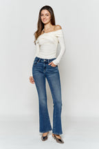 Women's blue bootcut jeans, perfect for pairing with boots