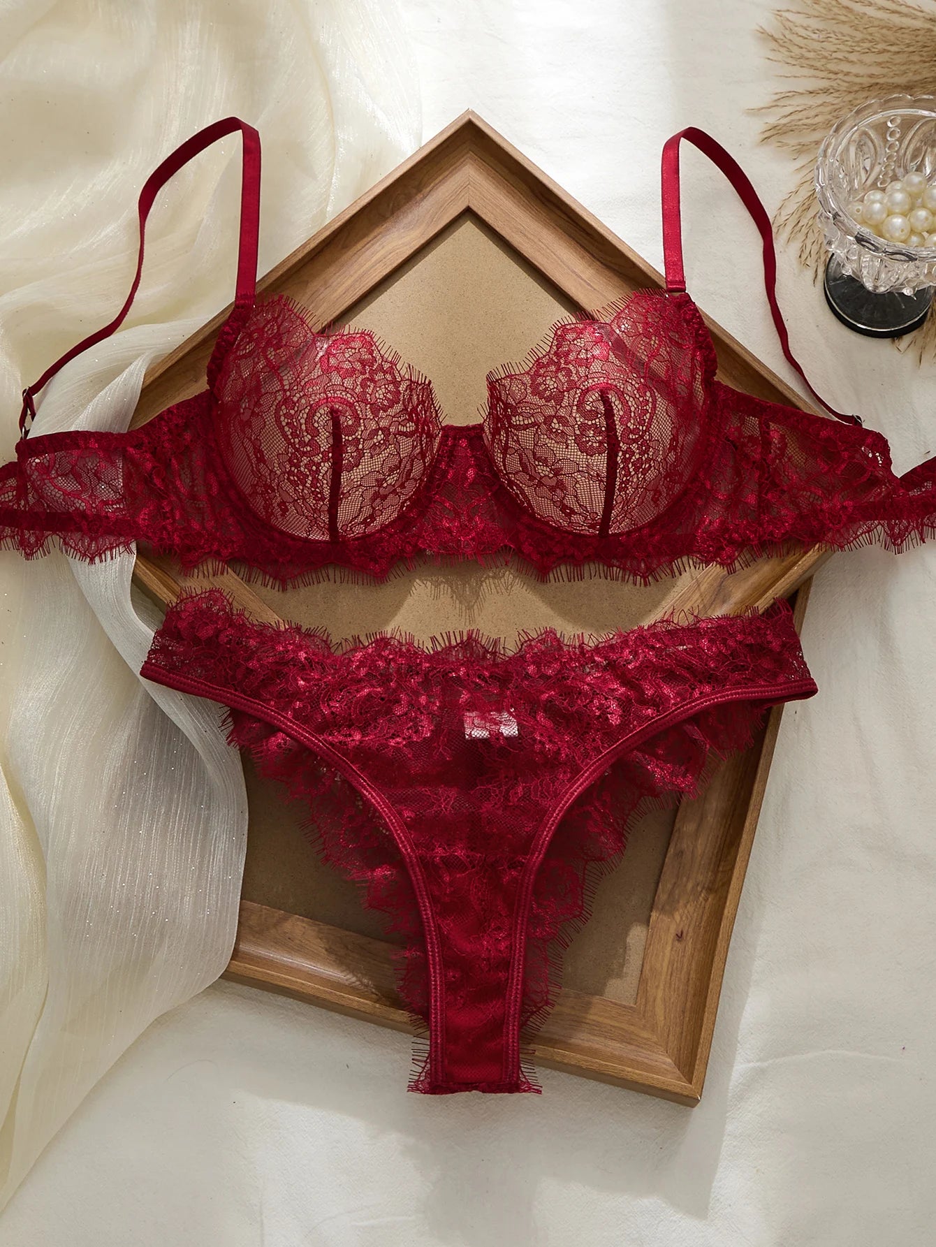 Red lace bra with matching thong for elegant lingerie sets