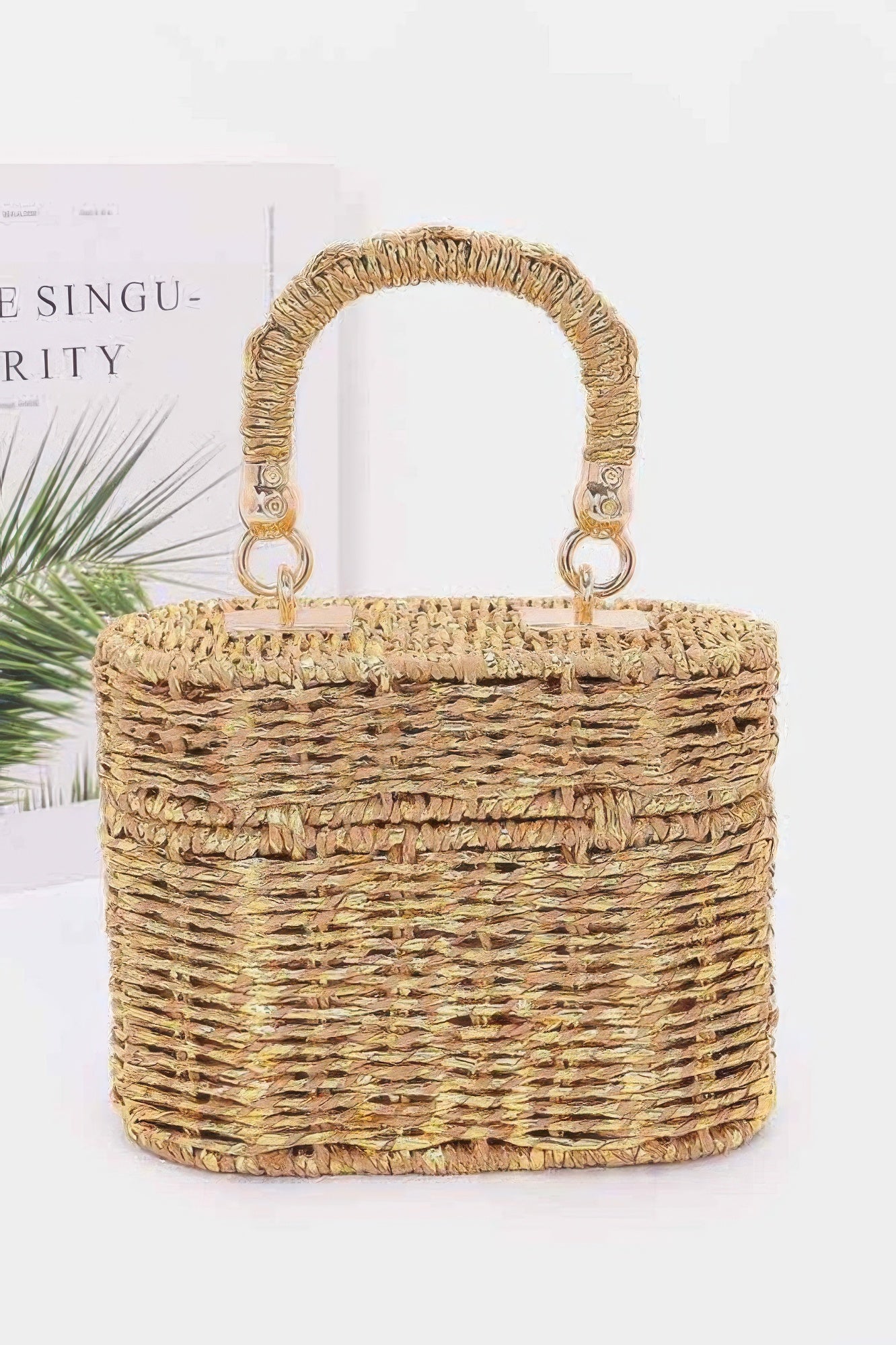 Braided cotton top handle bag in natural tones with a stylish woven design for everyday use