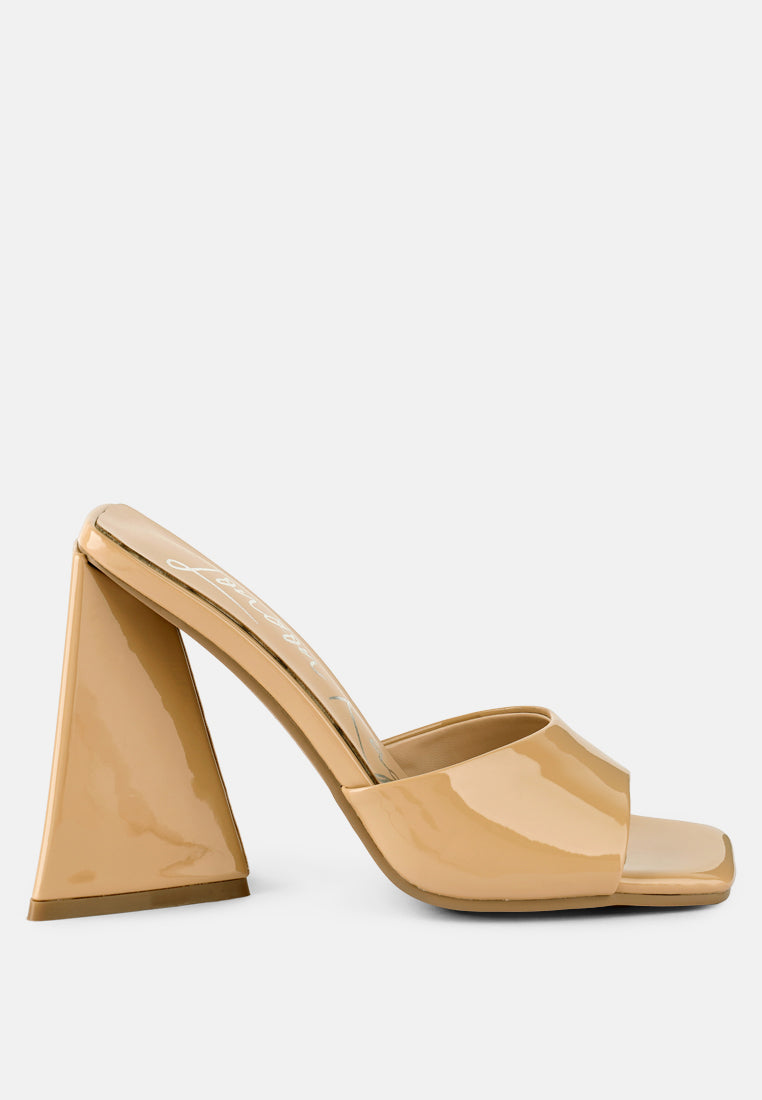 Stylish beige heeled sandals with a unique block heel design, perfect for chic outfits