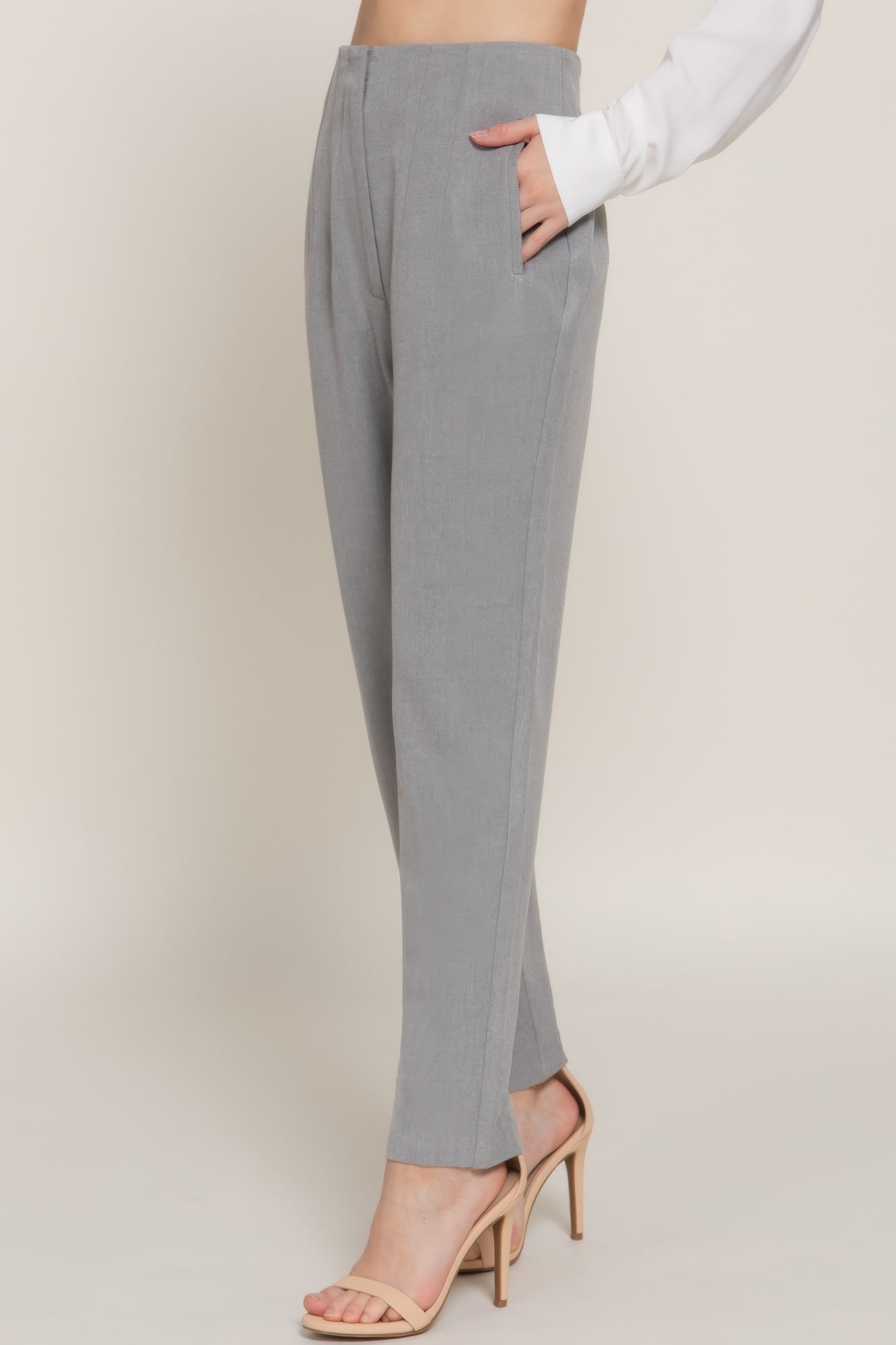 VacationGrabs women's stylish high rise trousers in light gray paired with beige heels