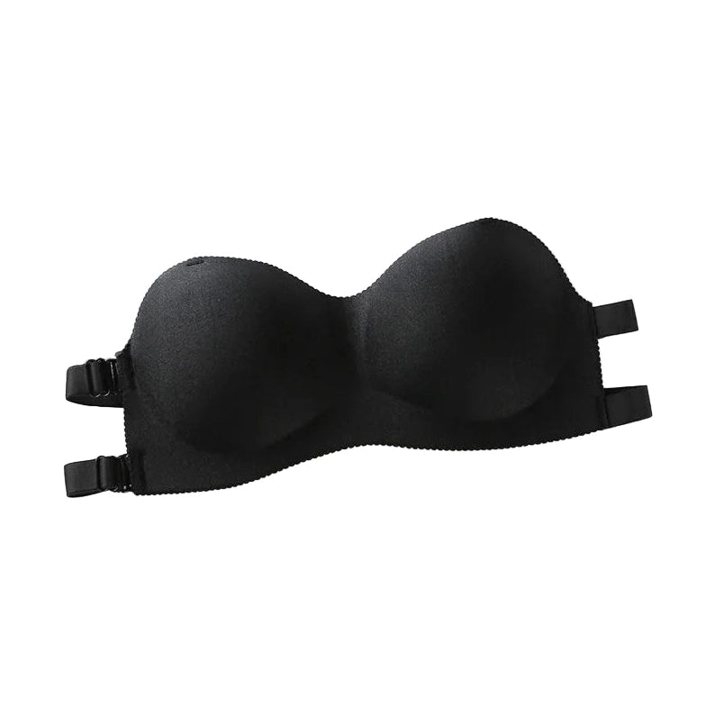 Black breathable fashion bandeau bra with adjustable straps laid flat on white surface with Paris-themed papers