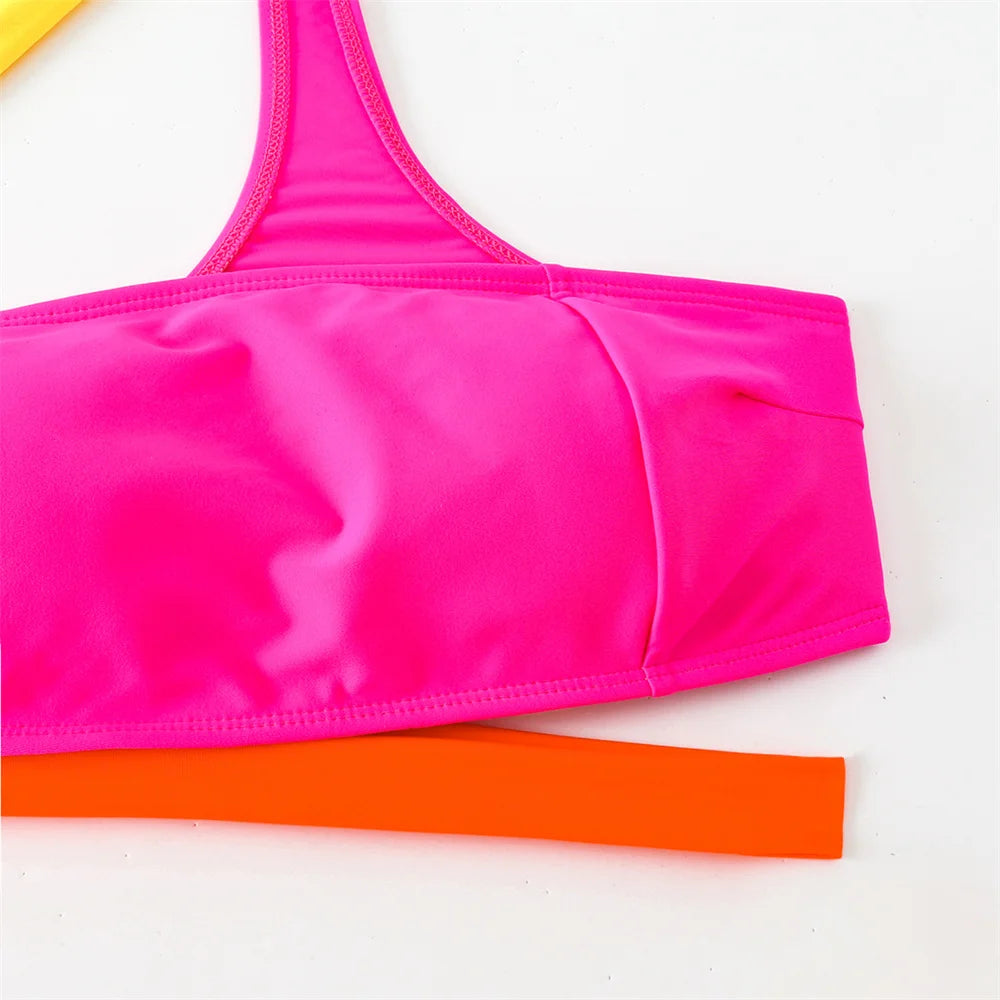 Women's bright beachwear in pink and orange for sunny days