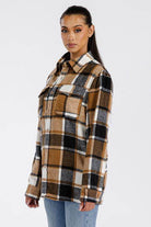 WEIV brown boyfriend flannel shacket featured on a model with a stylish plaid design