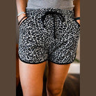 Leopard print women's shorts with pockets and drawstring, perfect for casual wear. Brown Justine shorts.
