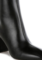 Stylish black leather ankle boots for women with pointed toe and block heel design