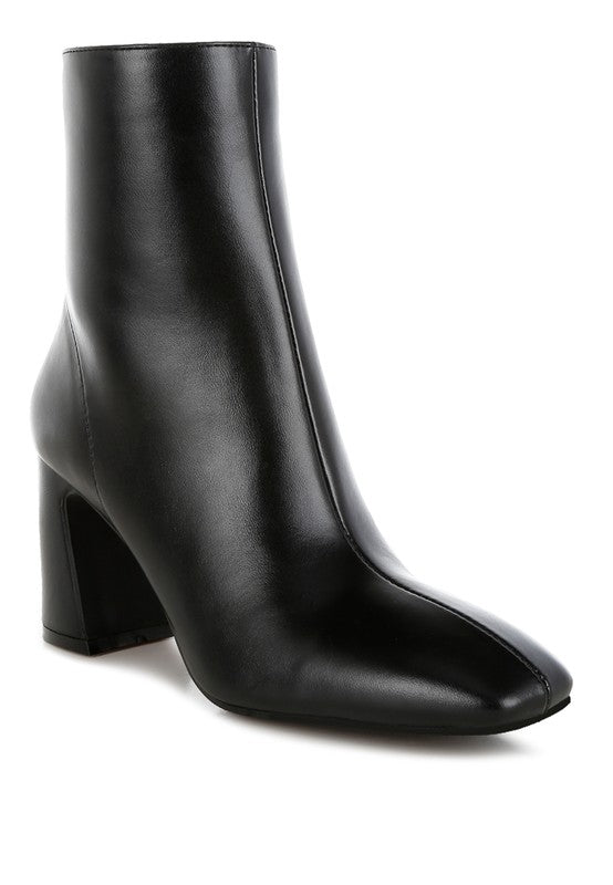 Stylish black leather ankle boots for women with a trendy block heel