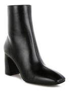 Stylish black leather ankle boots with a high heel, perfect for pairing with any outfit.