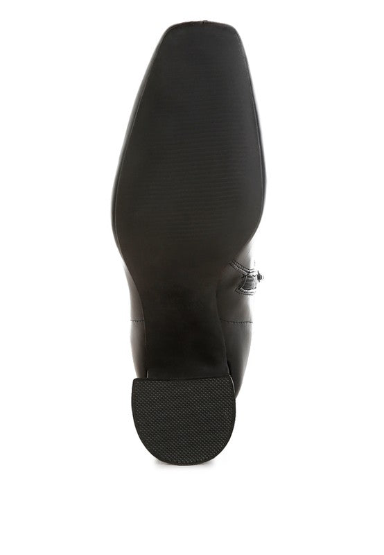 Bottom view of brown leather ankle boots for women with a durable rubber sole for stylish comfort