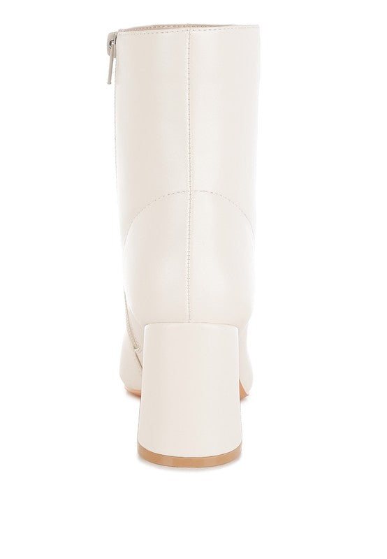Stylish brown leather ankle boots for women with a sleek design and sturdy chunky heel
