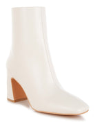 Stylish brown leather ankle boots for women with a modern block heel and a sleek design