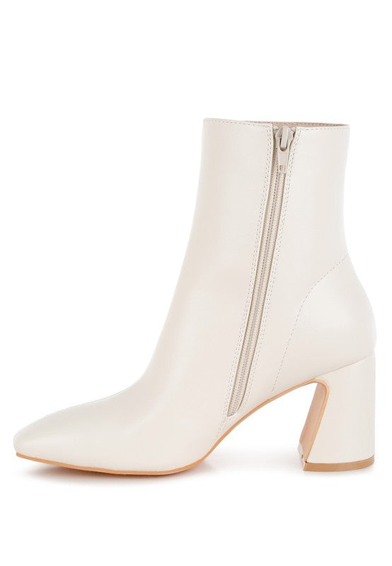 Stylish white ankle boots for women with a zip closure and block heels