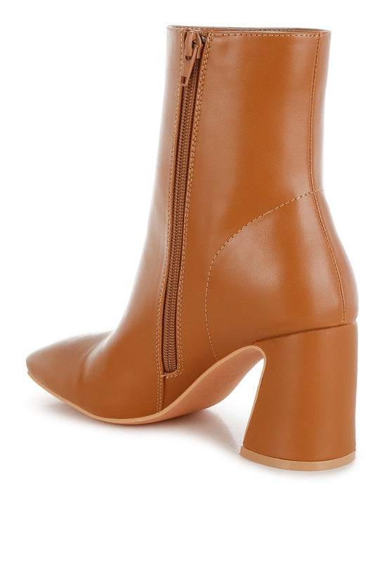 Stylish brown leather ankle boots for women with a chic pointed toe and block heel