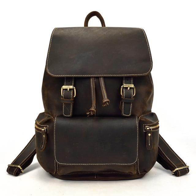 Brown leather laptop backpack with multiple pockets and adjustable straps for everyday use