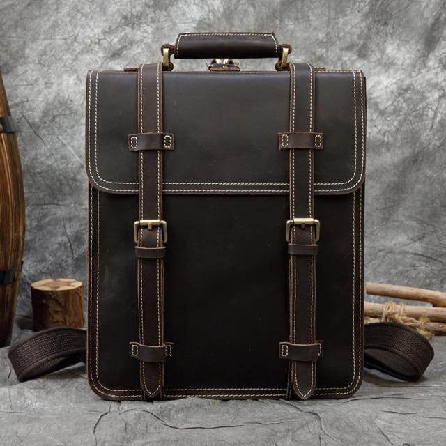 Brown leather laptop backpack with adjustable straps and sturdy design from VacationGrabs