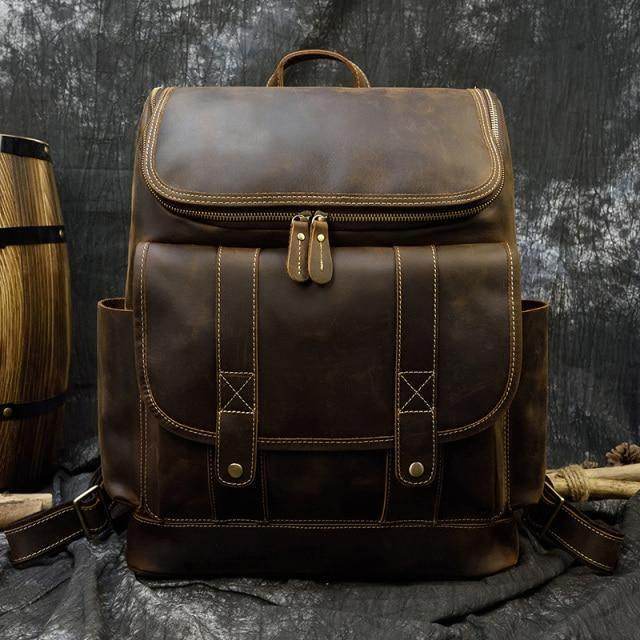 Stylish brown leather laptop backpack with multiple pockets and a durable design for everyday use