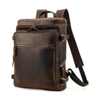 Brown leather laptop backpack with multiple pockets and adjustable straps for travel or daily use