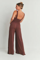 Back view of brown wide leg romper with a flattering fit and elegant design for women