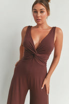 Stylish brown wide leg romper with a deep V-neck and twist front design for women