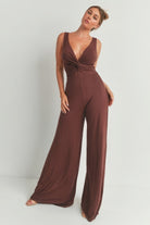 Stylish brown wide leg romper with deep V neckline and flattering twist detail for women's fashion