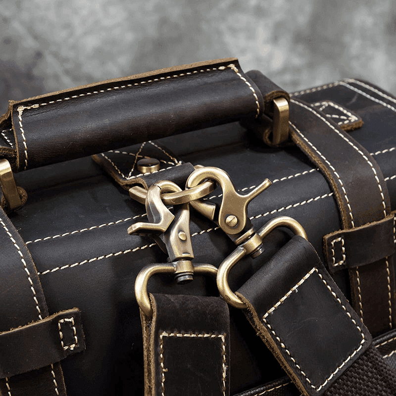 Close-up of VacationGrabs business travel backpack combo with durable straps and antique metal clasps