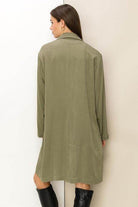 Olive green button front fall coat for women with a relaxed fit and long sleeves