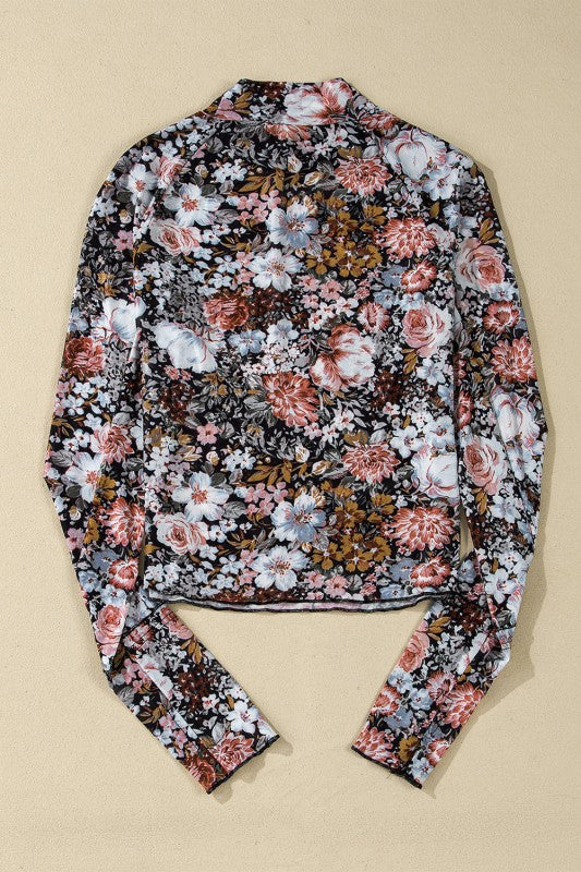 Back view of a JUNIPER BLVD mock neck floral blouse for women with colorful floral patterns.