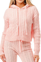 Women's cable knit hoodie sweater set in soft pink, featuring a cropped design and matching pants