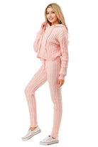 Women's cable knit hoodie sweater set in pink, featuring a cropped hoodie and fitted pants