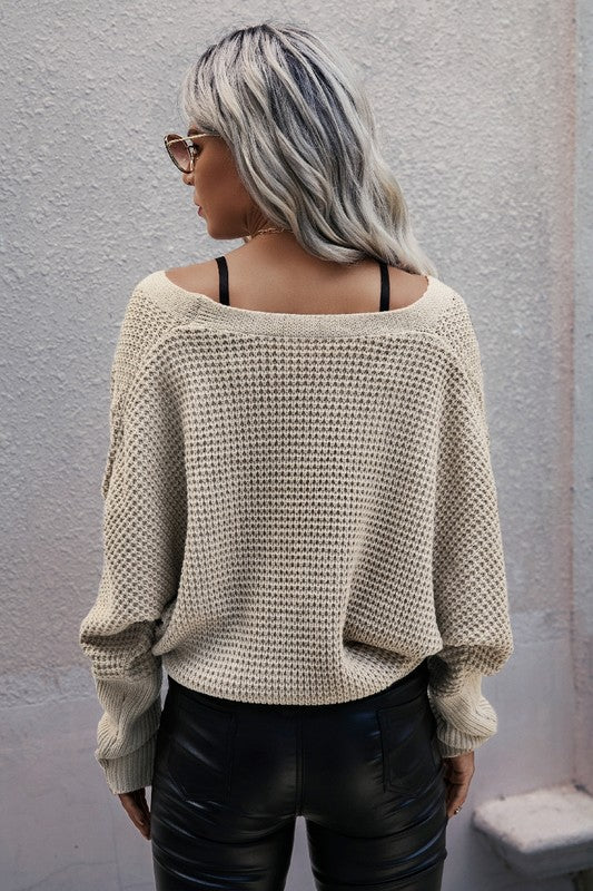 Women's cable knit sweater in beige, perfect for casual wear