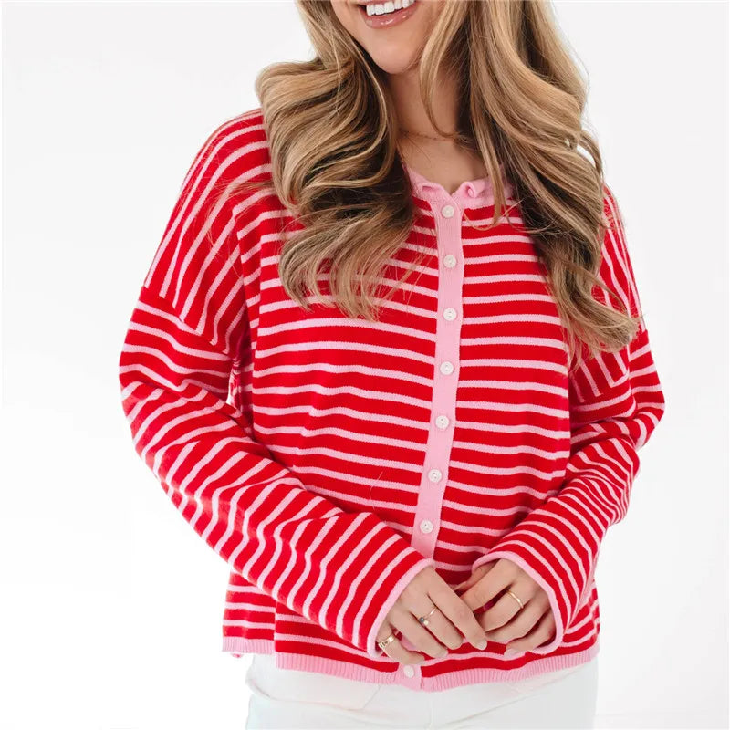 Women's red and pink striped cable knit sweater, perfect for casual outings