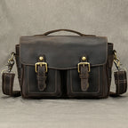 Brown leather camera bag with dual front pockets for photographers
