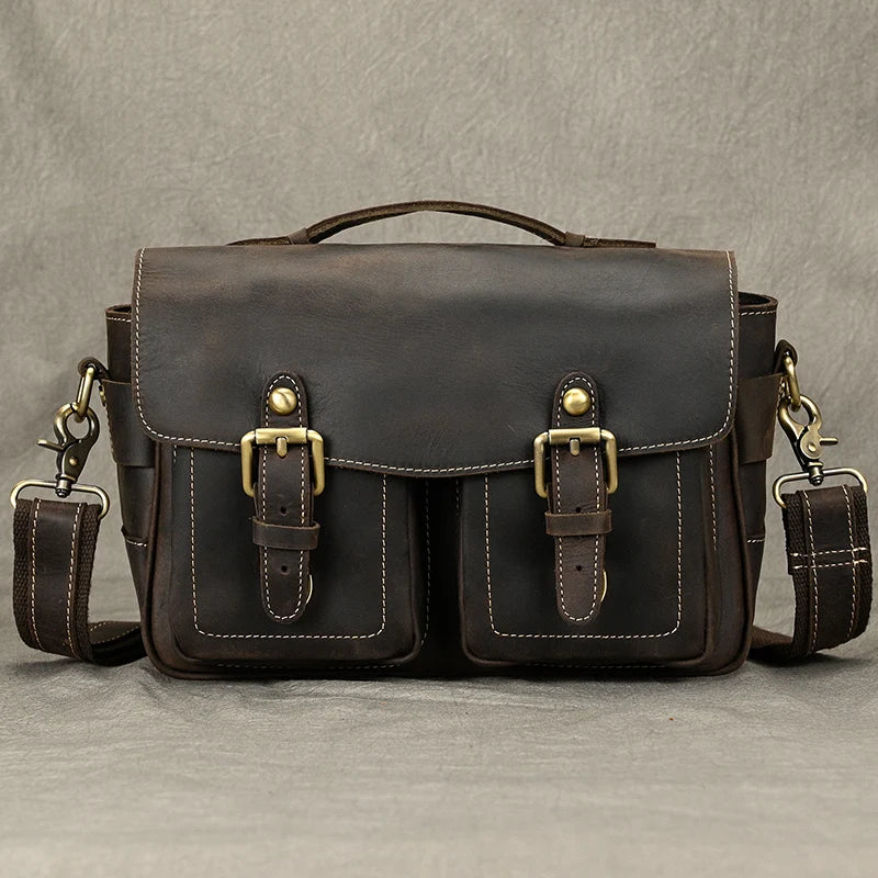 Brown leather camera bag with dual front pockets for photographers