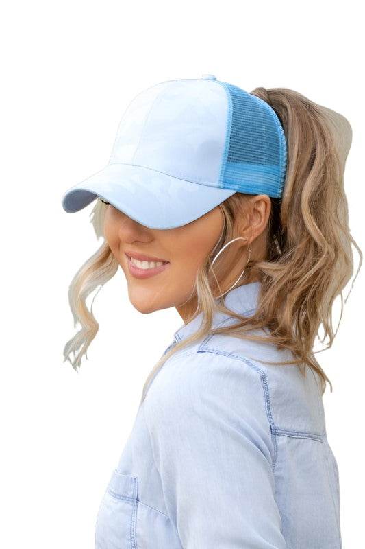 Light blue camouflage messy bun cap designed for women with a stylish ponytail opening