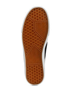 Bottom view of Rag Company canvas slip on sneakers showing brown textured rubber outsole