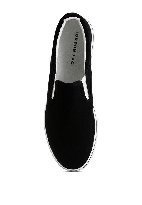 Rag Company black canvas slip on sneakers for women with white sole and minimalist design