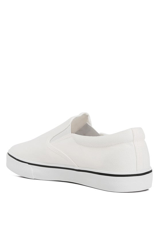 Rag Company women's white canvas slip on sneakers with black trim and rubber sole