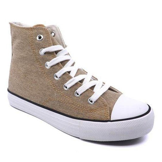 Trendy women's canvas sneakers with patterns in beige featuring white laces and rubber sole