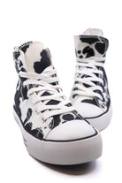 Trendy canvas sneakers with patterns in black and white cow print for women