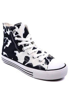 Women's canvas sneakers with patterns in black and white cow print design for casual wear