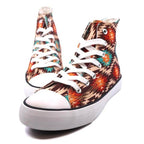 Stylish women's canvas sneakers with patterns featuring colorful tribal designs and white laces