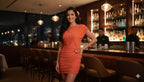 Women's cap sleeve mini dress in orange, perfect for clubwear.