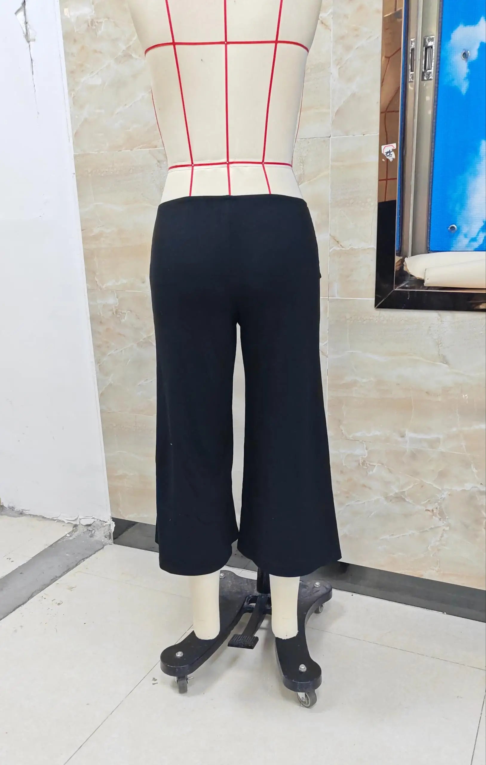 Women's black capri dress pants, stretchy fabric for comfort.