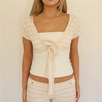 Women's cropped cardigan in white and beige, perfect for casual outings